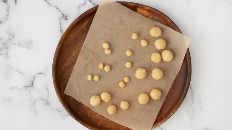 dough balls on wooden board