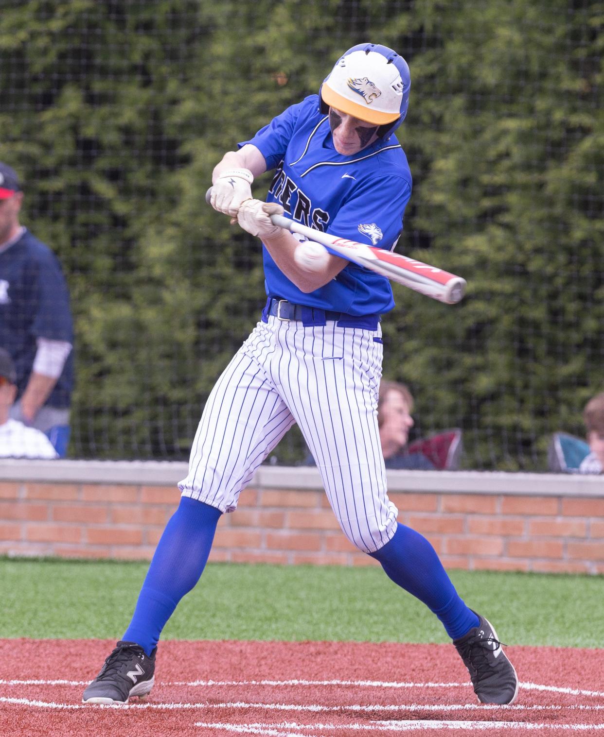 Lake Center Christian's Grant Coblentz connects for a single in the first inning against Warren JFK at Lake Center Christian Monday, May 6, 2024.