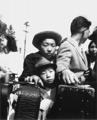 Young evacuees of Japanese ancestry wait their turn for baggage inspection, Turlock, CA, 1942
