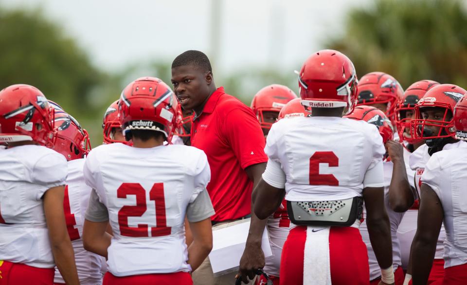 Immokalee head coach Rodelin Anthony talks with his team before the game against Barron Collier at Barron Collier High Friday night, September 13, 2019. 