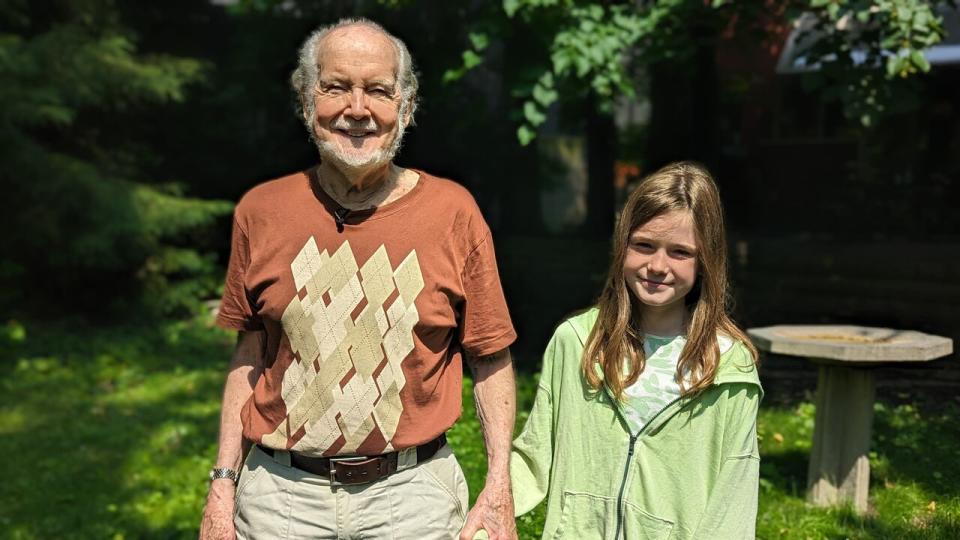 Chris Keating, of the Deer Park Residents Group and pictured here with his 10-year-old granddaughter, says it's important to take action against climate polluters like gas-powered leaf blowers, in order to protect future generations.