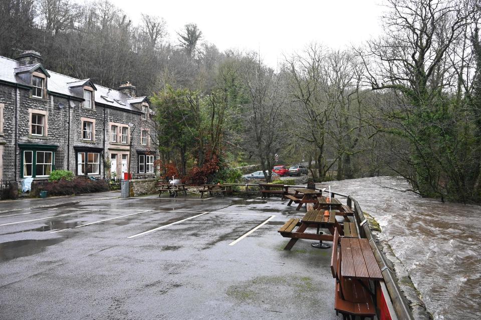 The river Wye laps at a car park near Great Longstone, north-west England.