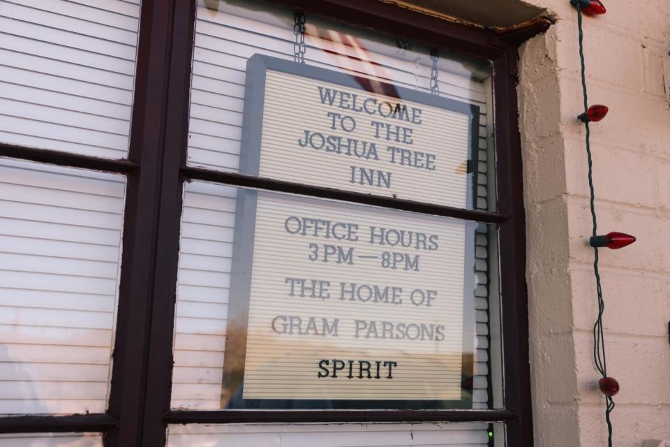 Signage welcomes folks to Joshua Tree Inn, the "home of Gram Parsons' spirit."
