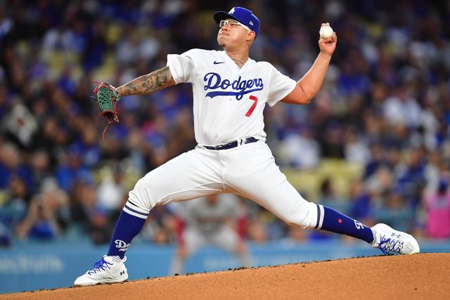 Julio Urias pitches against the Diamondbacks on opening day.
