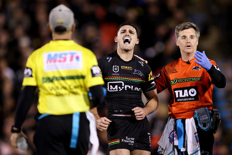 PENRITH, AUSTRALIA - AUGUST 15: Nathan Cleary of the Panthers reacts after taking a knock to his shoulder during the round 24 NRL match between Penrith Panthers and Melbourne Storm at BlueBet Stadium, on August 15, 2024, in Penrith, Australia. (Photo by Brendon Thorne/Getty Images)