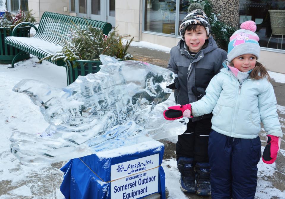 Ryder and Rowan Cumo, Bedford, enjoyed the ice sculpture on the Diamond in Somerset last year, during the 28th annual Fire & Ice Festival. 
(Credit: Staff photo by Madolin Edwards)