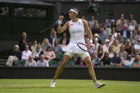 France's Caroline Garcia celebrates winning the first set against Britain's Emma Raducanu during their singles tennis match against on day three of the Wimbledon tennis championships in London, Wednesday, June 29, 2022. (AP Photo/Alastair Grant)