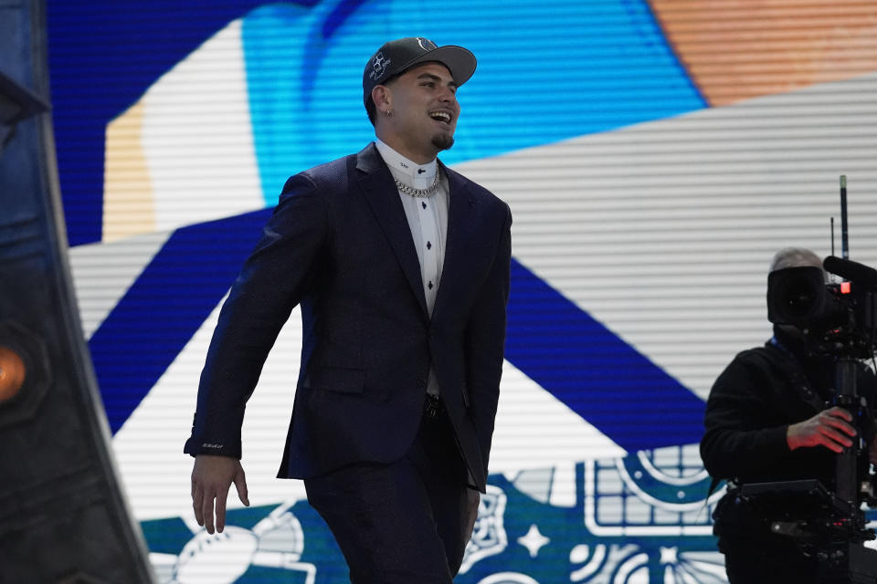 UCLA defensive lineman Laiatu Latu reacts after being chosen by the Indianapolis Colts with the 15th overall pick during the first round of the NFL football draft, Thursday, April 25, 2024, in Detroit. (AP Photo/Jeff Roberson)