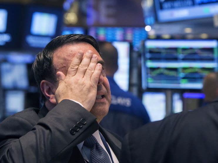 An NYSE official gestures after the resumption of trading following a several hour long stoppage on the floor of the New York Stock Exchange, July 8, 2015. REUTERS/Lucas Jackson 