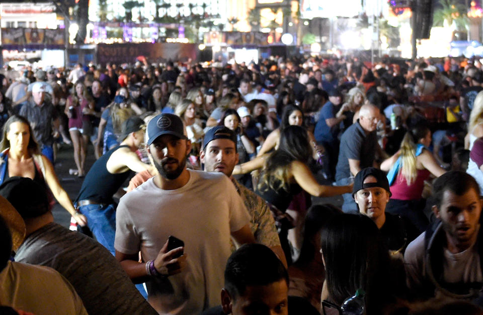 People flee the Route 91 Harvest music festival grounds in Las Vegas after a shooter was reported on Oct. 1. (Photo: David Becker/Getty Images)