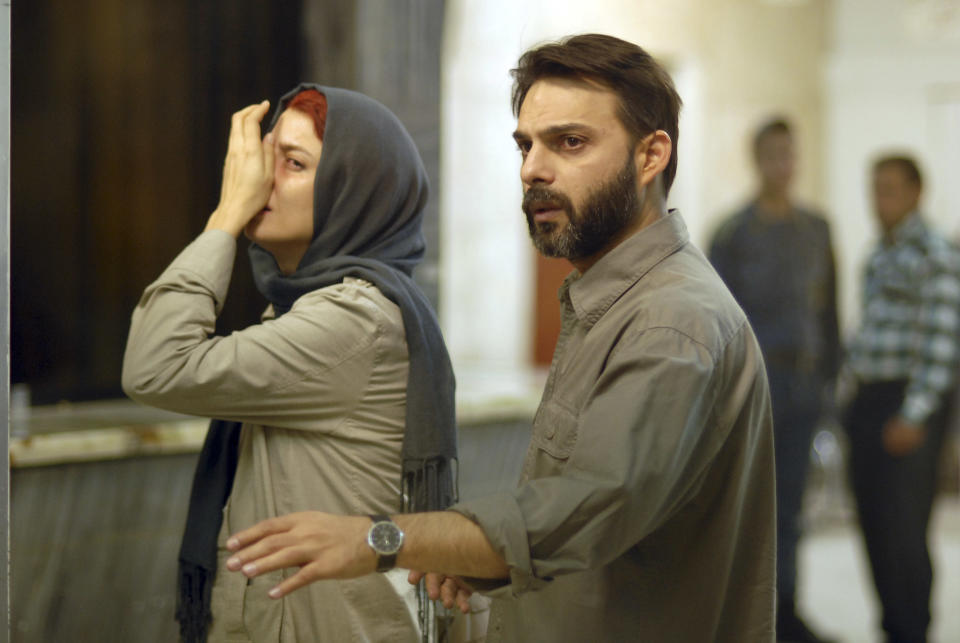 FILE - In this undated file photo released by Filmiran film distributing company, Iranian actress Leila Hatami, and actor Peyman Moadi, act in a scene of movie "A Separation" which won the Academy Award for best foreign film. Iranian authorities canceled a ceremony Monday in honor of the country's Oscar-winning director even though the government had hailed his win as a triumph over a competitor from Israel. There were no details as to why a permit was denied but some Iranian conservatives were upset with the film's themes: domestic turmoil, gender inequality and the desire by many to leave the country. (AP Photo/Filmiran International Company, Habib Majidi, File)