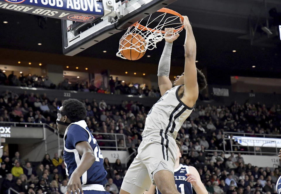 Providence's Ed Croswell (5) dunks the ball during the first half of an NCAA college basketball game against Butler, Wednesday, Jan. 25, 2023, in Providence, R.I. (AP Photo/Mark Stockwell)