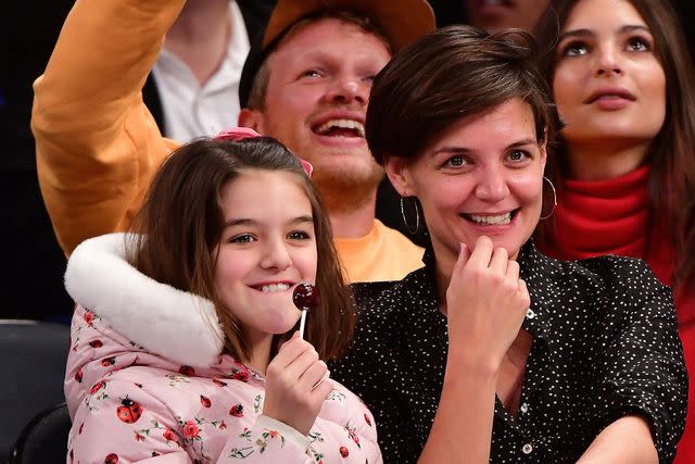 <p>James Devaney/Getty</p> Suri Cruise and Katie Holmes