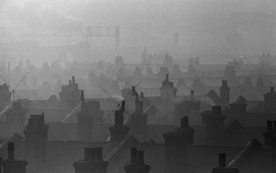 Smog caused by coal fires hangs over the roof tops of Battersea, London, 7th December 1962. (Photo by Ron Burton/Mirrorpix/Getty Images) - Getty