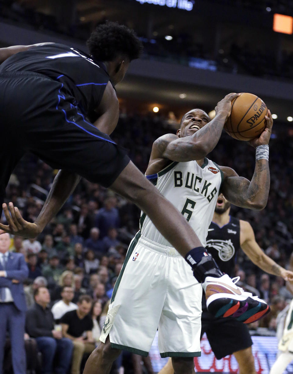 Milwaukee Bucks' Eric Bledsoe looks to shoot past Orlando Magic's Jonathan Isaac during the second half of an NBA basketball game Saturday, Feb. 9, 2019, in Milwaukee. (AP Photo/Aaron Gash)