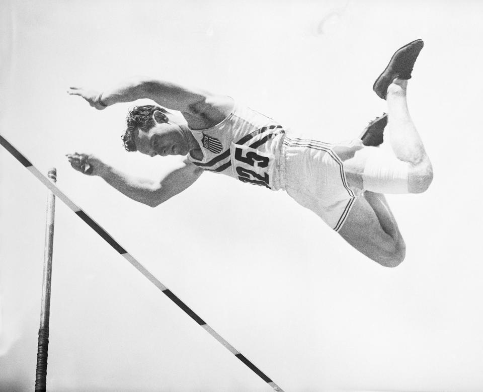 Pole vaulter Rev. Bob Richards of La Verne, California, hurdles earthward after clearing the bar during the pole vault event in 1952 in Helsinki, Finland. / Credit: Bettmann / Getty Images