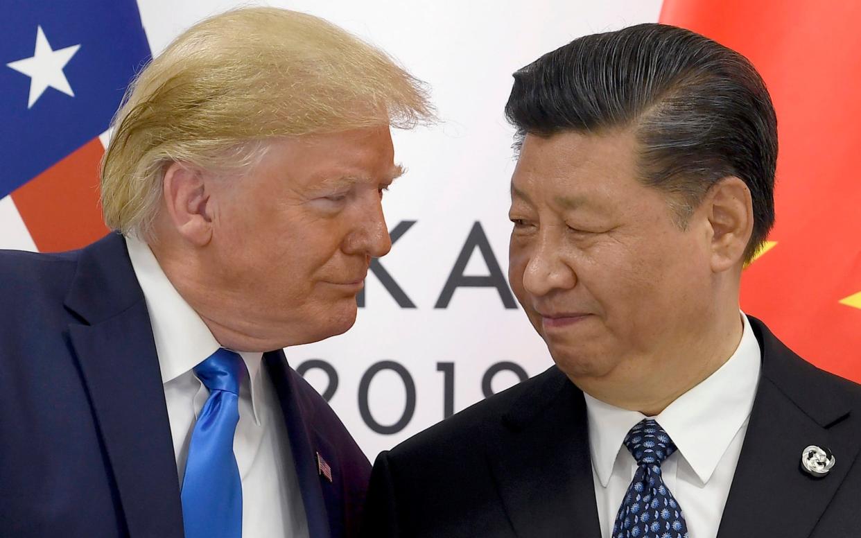 President Trump with China's President Xi Jinping at the G20 Summit last June - AP