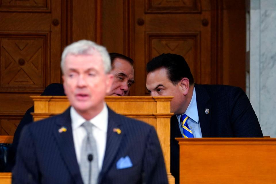 Assembly Speaker Craig Coughlin, back left, and Senate President Nick Scutari, back right, speak during Gov. Phil Murphy's budget address at the New Jersey Statehouse on Tuesday, Feb. 28, 2023.