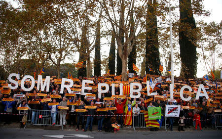 Protesters take part in a demonstration called by pro-independence asociations asking for the release of jailed Catalan activists and leaders, in Barcelona, Spain, November 11, 2017. The sign reads "We are a republic." REUTERS/Javier Barbancho