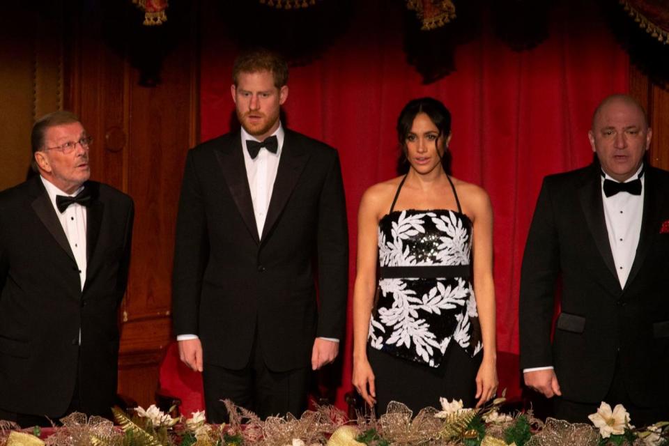 The Duke and Duchess of Sussex take their seats in the Royal box for the performance (PA)