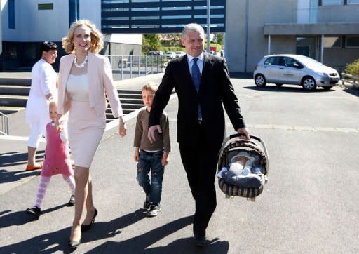 Iceland presidential candidate Thora Arnorsdottir (L) walks alongside her husband and children as she arrives to vote at a polling station in ReykjavÃ­k. Arnorsdottir, a respected 37-year-old journalist with no political affiliation and mum to a newborn, acknowledged defeat in Iceland's presidential election on Saturday