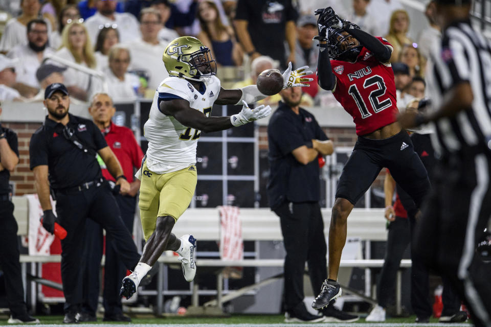 Georgia Tech wide receiver Adonicas Sanders (12) can't make the catch as Northern Illinois cornerback Eric Rogers (12) defends during the first half of an NCAA college football game, Saturday, Sept. 4, 2021, in Atlanta. (AP Photo/Danny Karnik)