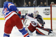 New York Rangers defenseman Brendan Smith (42) shoots as Columbus Blue Jackets goaltender Matiss Kivlenieks (80) reacts during the second period of an NHL hockey game, Sunday, Jan. 19, 2020, in New York. (AP Photo/Kathy Willens)