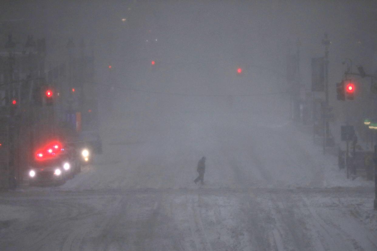 People walk through the snow in Manhattan.