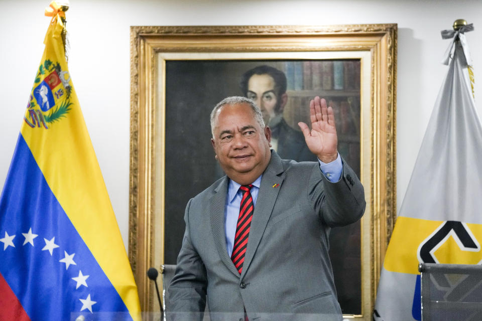 National Electoral Council (CNE) President Elvis Hidrobo Amoroso waves to the press at the National Electoral Council headquarters in Caracas, Venezuela, Tuesday, March 5, 2024. Amoroso announced that Venezuela's presidential election will take place on July 28. (AP Photo/Ariana Cubillos)