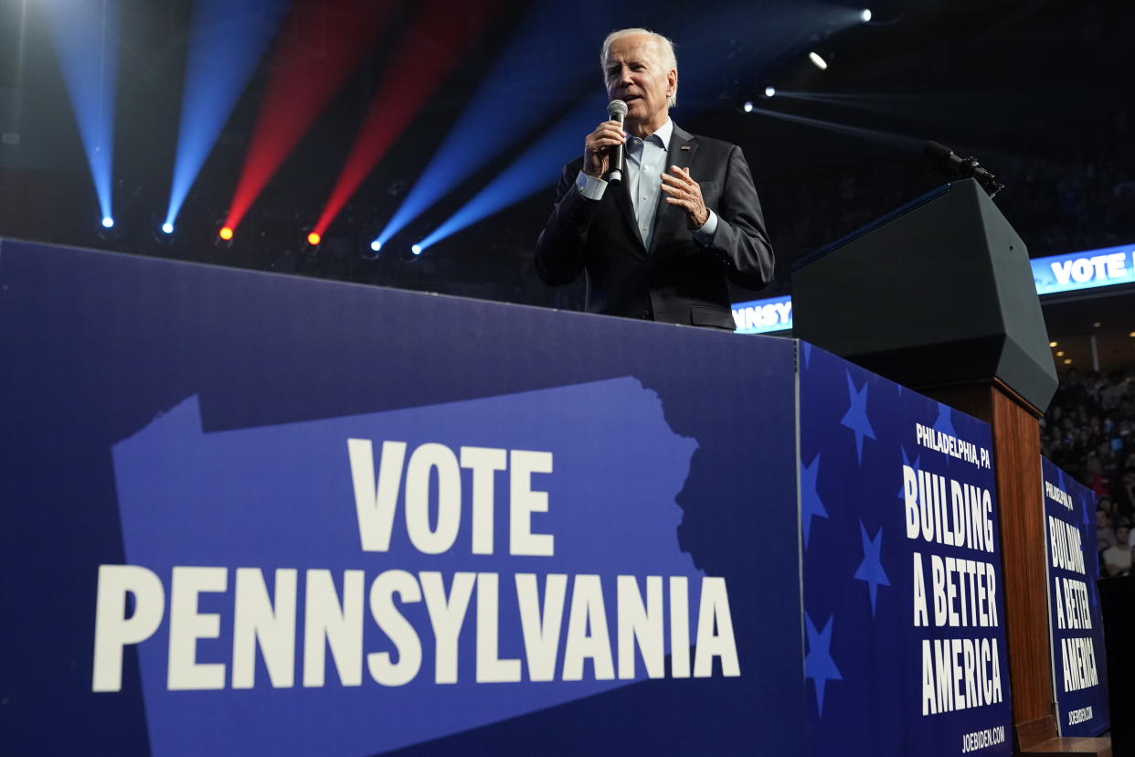 President Biden at the microphone above posters reading: Vote Pennsylvania and Building a Better America.