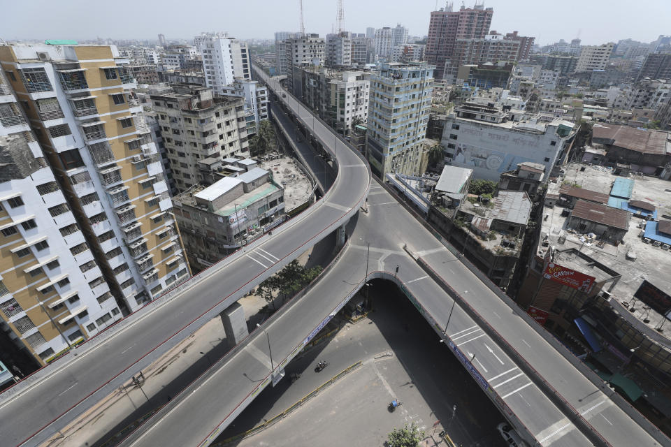 City streets wear a deserted look following lockdown to curb the spread of coronavirus in Dhaka, Bangladesh, Wednesday, April 14, 2021. Bangladesh is enforcing a lockdown shutting shopping malls and transportation, to help curb the spread of coronavirus as the rate of infections and deaths have increased in recent weeks. (AP Photo/Mahmud Hossain Opu)