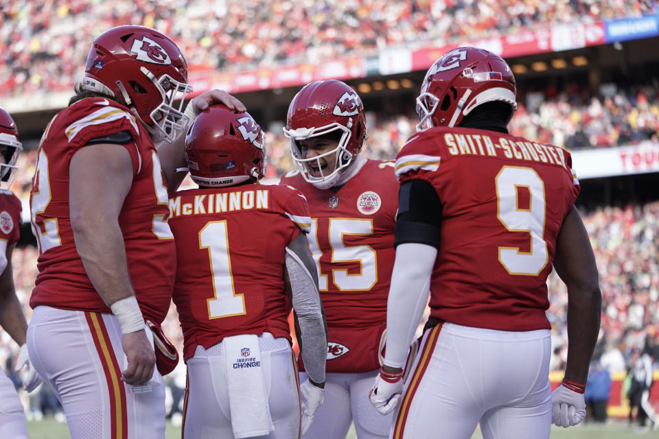 Kansas City Chiefs running back Jerick McKinnon (1) is congratulated by quarterback Patrick Mahomes (15) after scoring during the first half of an NFL football game against the Seattle Seahawks Saturday, Dec. 24, 2022, in Kansas City, Mo. (AP Photo/Ed Zurga)