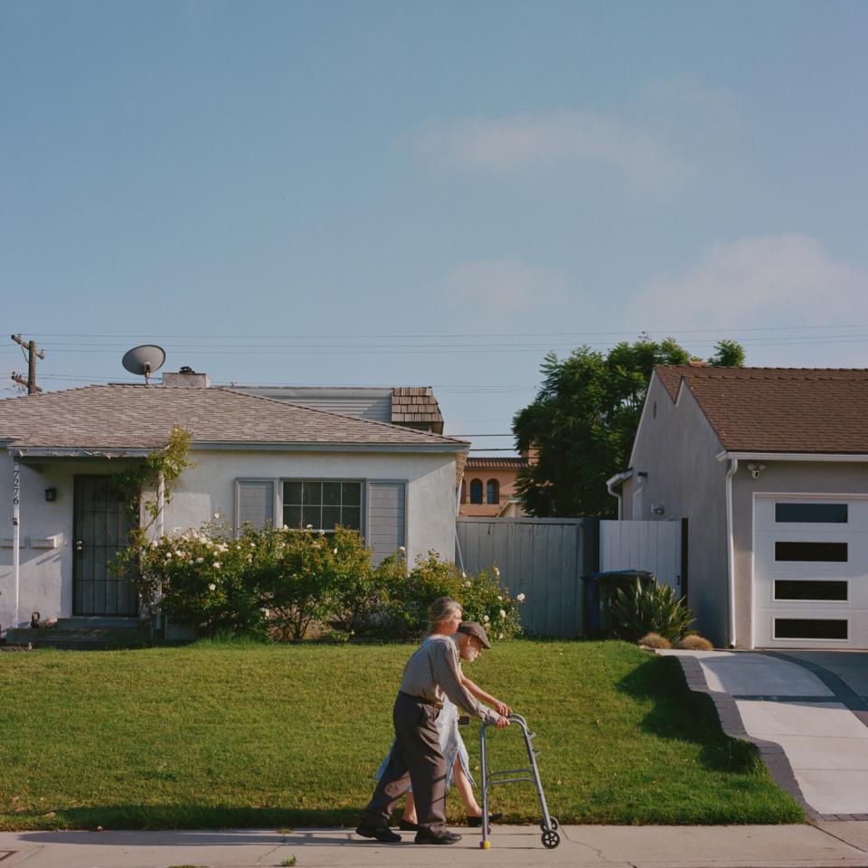 Susan and Andrzej Stefanski walk together in their neighborhood.