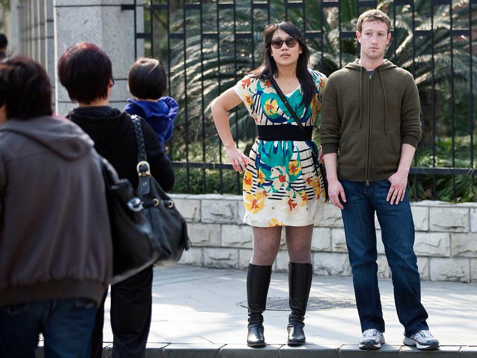 Priscilla Chan and Mark Zuckerberg standing on street in China