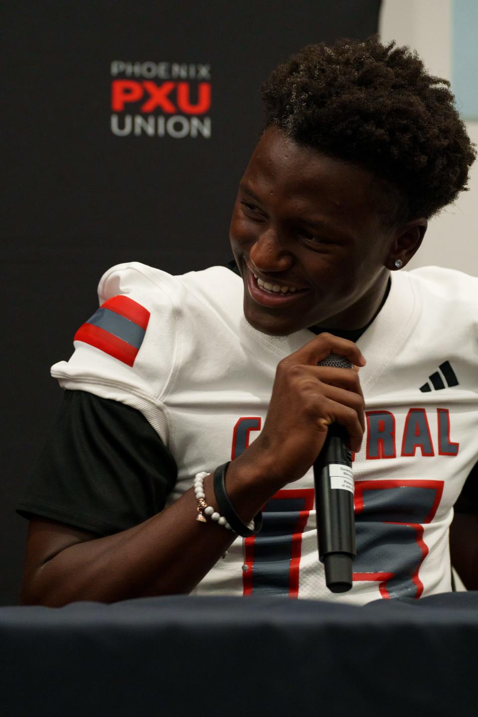 Central High School's Ismail Foz announces his commitment to Northern Arizona University at the Phoenix Union High School District Football media day in the district building in Phoenix on Aug. 21, 2023.