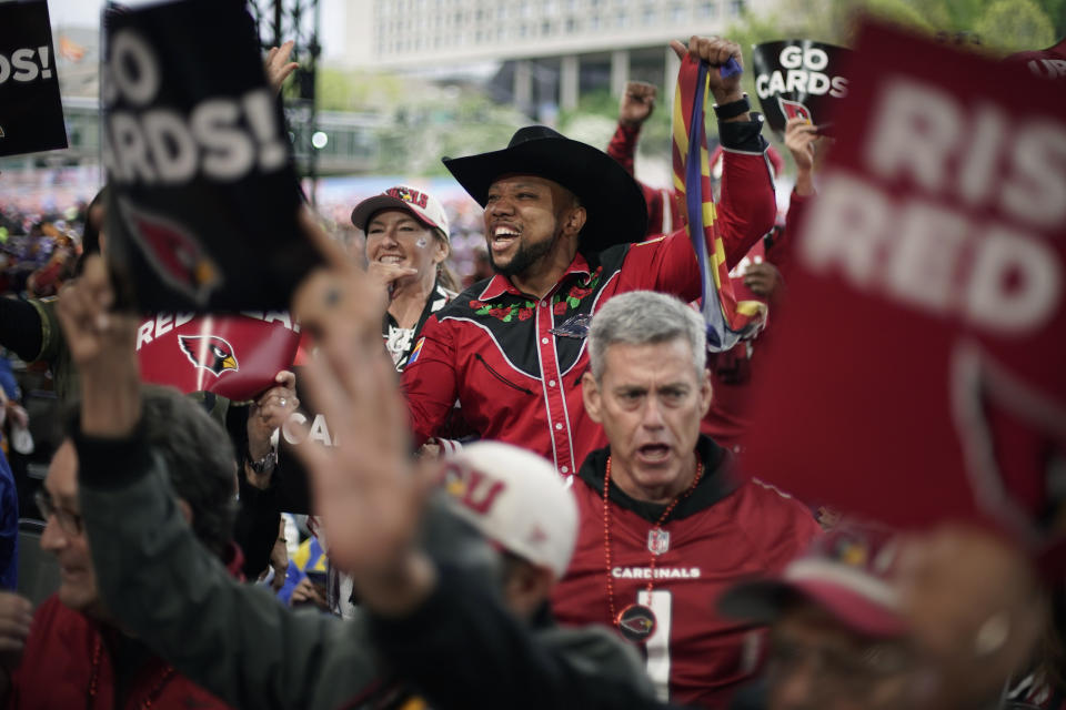 Arizona Cardinals fans cheer during the second round of the NFL football draft, Friday, April 28, 2023, in Kansas City, Mo. (AP Photo/Charlie Riedel)
