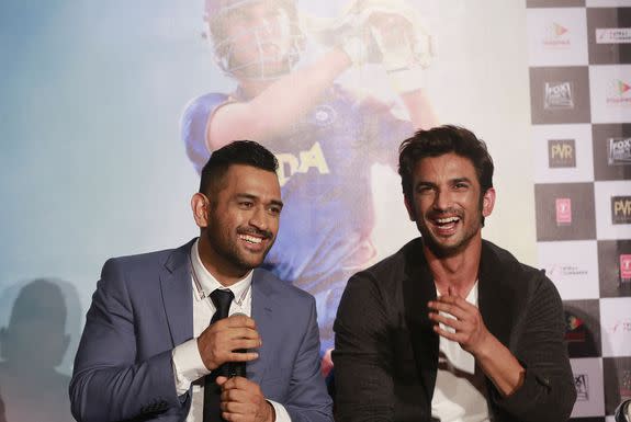 Indian cricketer Mahendra Singh Dhoni, left, shares a light moment with Bollywood actor Sushant Singh Rajput as they speak with the media during the trailer launch of upcoming movie 'MS Dhoni: The Untold Story' in Mumbai, India, Thursday, Aug 11, 2016.