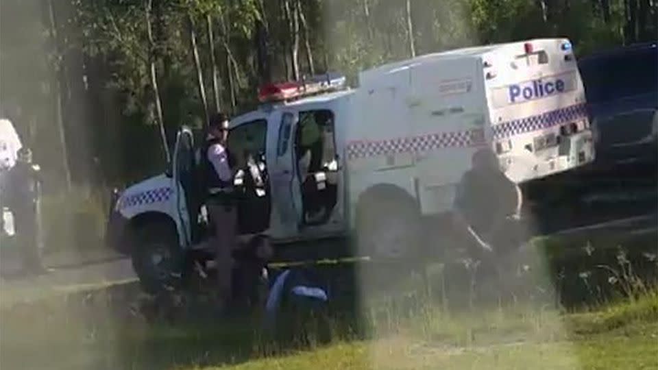 A colleague can be seen desperately applying CPR to the wounded officer. Source: Daily Mail