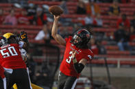 Texas Tech's Henry Colombi (3) passes the ball during the first half of an NCAA football game against West Virginia, Saturday, Oct. 24, 2020, in Lubbock, Texas. (AP Photo/Brad Tollefson)