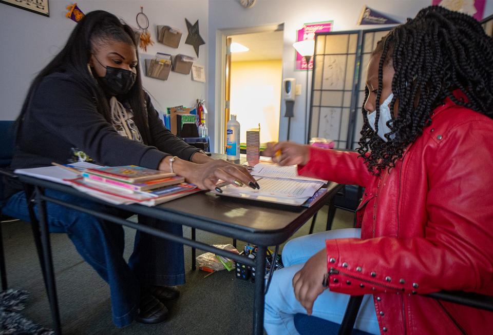 Erica Waller-Hill, left, owner of Destined for a Dream Foundation in Bristol Township, tutors Azariyah Bess, 9, of Bristol Township, with her multiplication table, Thursday, Mar. 10, 2022.