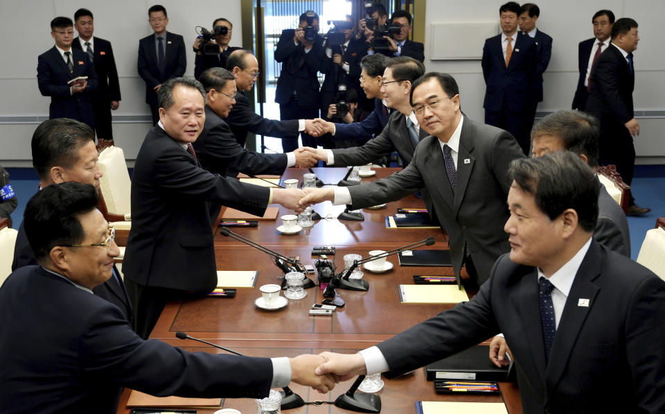 South Korean Unification Minister Cho Myoung-gyon, center right, shakes hands with his North Korean counterpart Ri Son Gwon during their meeting at the southern side of Panmunjom in the Demilitarized Zone, South Korea, Monday, Oct. 15, 2018. The rival Koreas are holding high-level talks Monday to discuss further engagement amid a global diplomatic push to resolve the nuclear standoff with North Korea. (Korea Pool/Yonhap via AP)