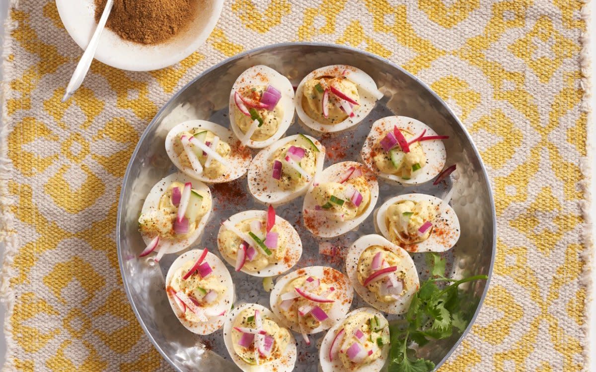 <p>Mark Boughton Photography</p><p>These eggs get an Indian twist with tandoori masala spices, radishes and cilantro.</p><p><strong>Get the recipe: <a href="https://parade.com/928203/parade/maneet-chauhan-masala-deviled-eggs/" rel="nofollow noopener" target="_blank" data-ylk="slk:Masala Deviled Eggs;elm:context_link;itc:0;sec:content-canvas" class="link rapid-noclick-resp">Masala Deviled Eggs</a></strong></p>