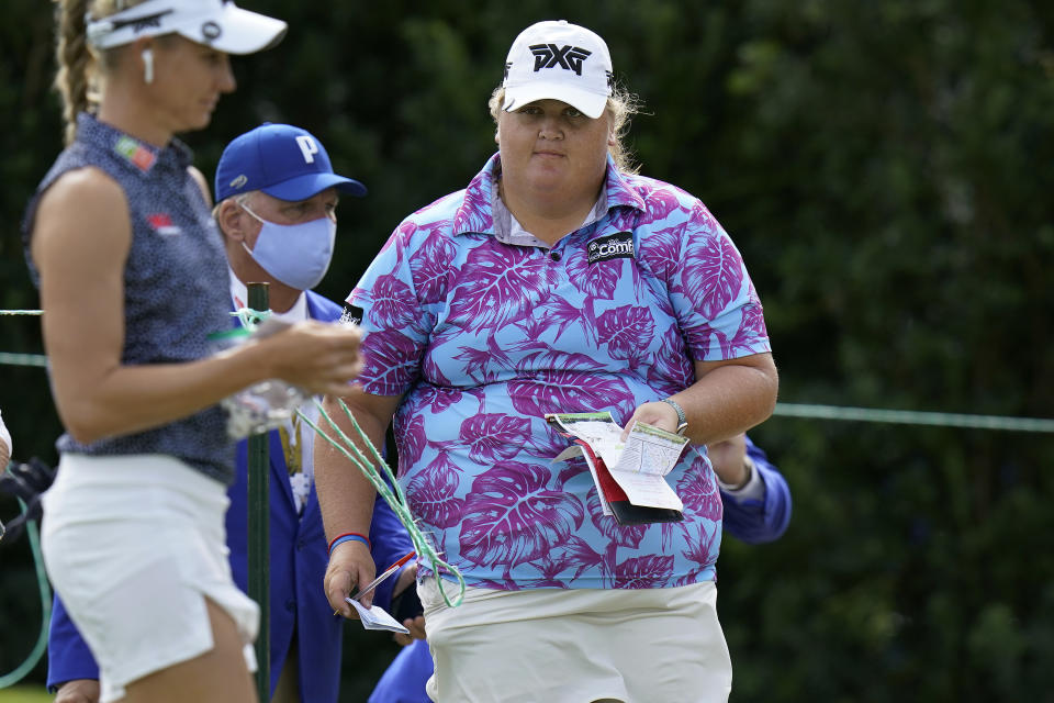 Haley Moore, right, walks to the tee on the first hole during the first round of the LPGA Pelican Women's Championship golf tournament Thursday, Nov. 19, 2020, in Belleair, Fla. (AP Photo/Chris O'Meara)