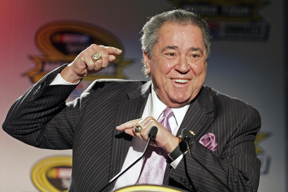 FILE - In this Jan. 28, 2014, file photo, Felix Sabates, right, co-owner of Chip Ganassi Racing, speaks during a news conference at the NASCAR Sprint Cup auto racing Media Tour in Charlotte, N.C. Felix Sabates is leaving NASCAR after 30 years as a team owner. His record shows 50 Cup wins, including victories at the crown jewels Daytona 500, Brickyard 400 and NASCAR's All-Star race. (AP Photo/Chuck Burton, File)