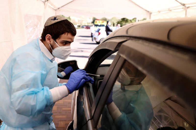 FILE PHOTO: Mass coronavirus disease (COVID-19) testing as Israel faces a surge in Omicron variant infections