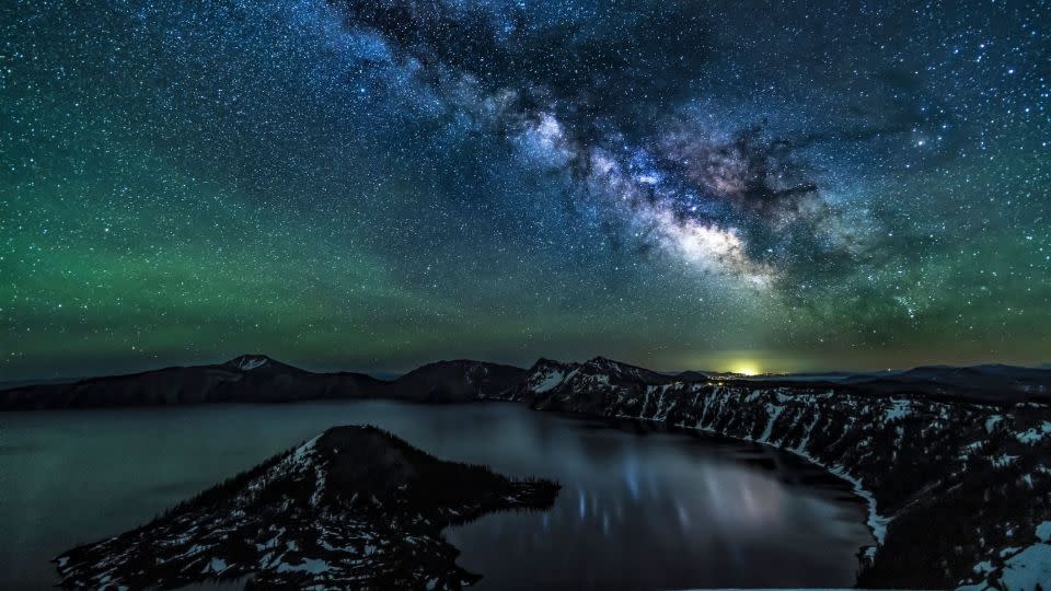 The Milky Way over Crater Lake - lightphoto/iStockphoto