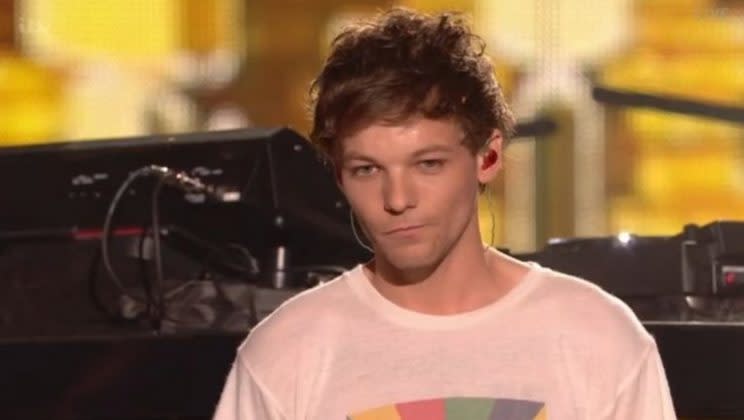 Louis fought back tears following his X Factor performance.
