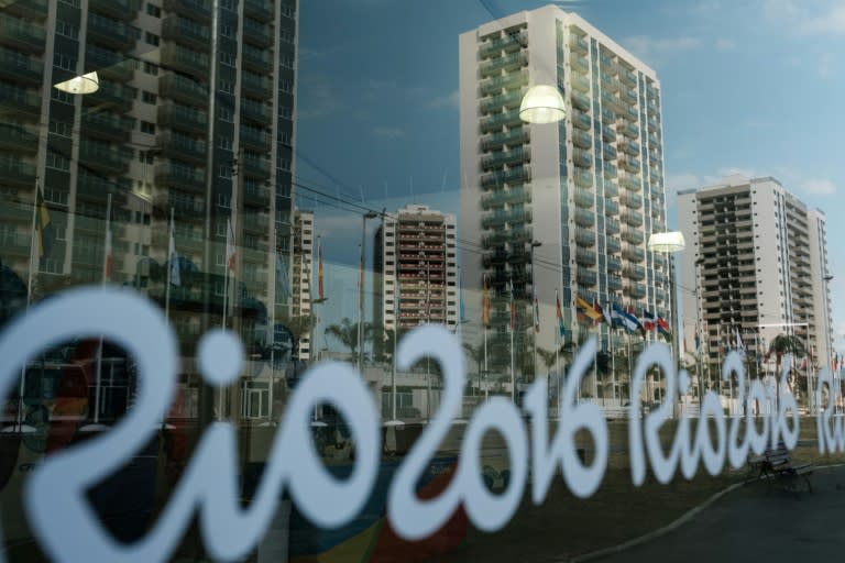 Athletes are reflected on a glass at the Olympic and Paralympic Village in Rio de Janeiro, Brazil, on July 23, 2016