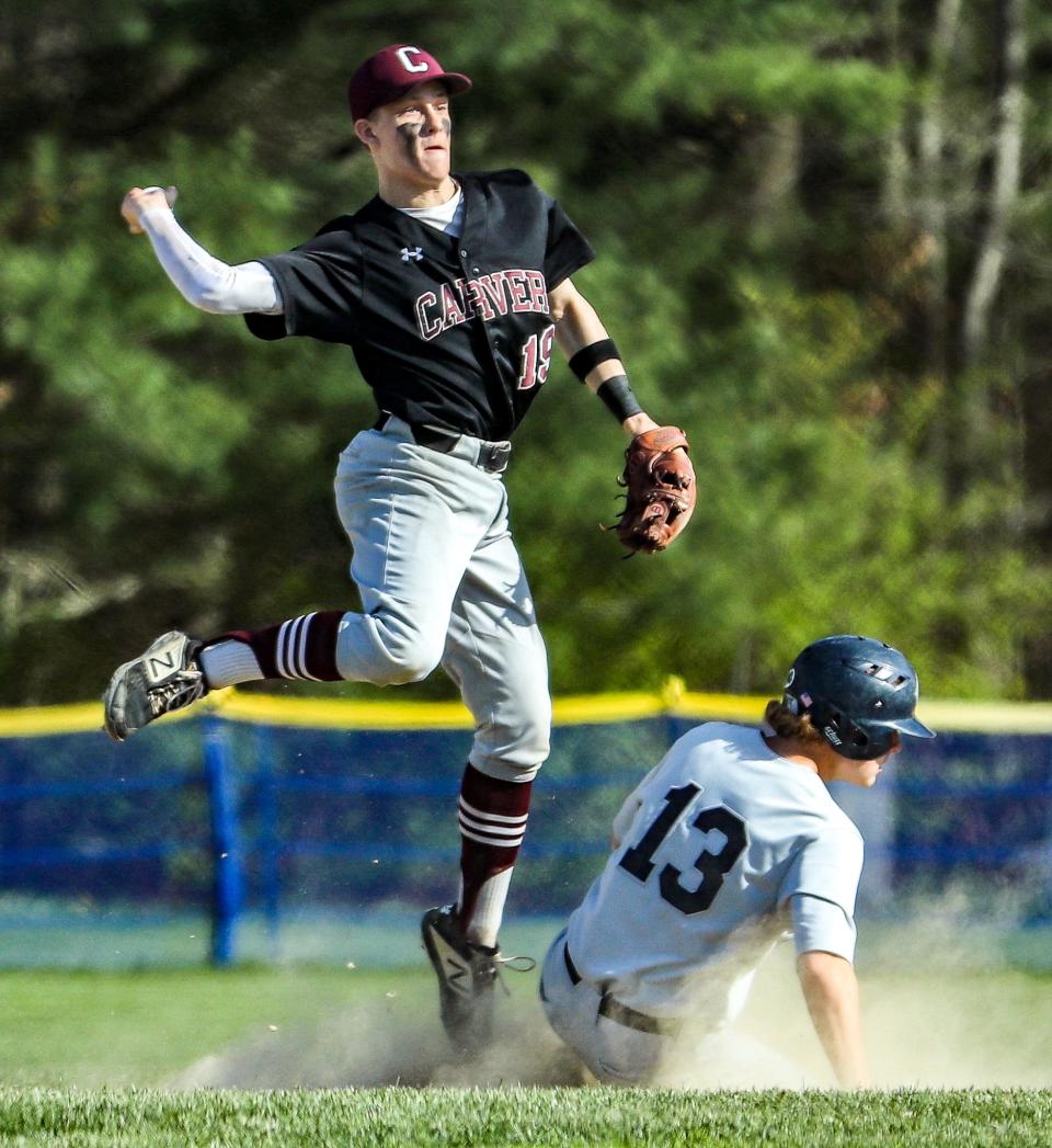 Carver's Justin Minahan turns a double play during a game against Cohasset on Thursday, May 12, 2022.