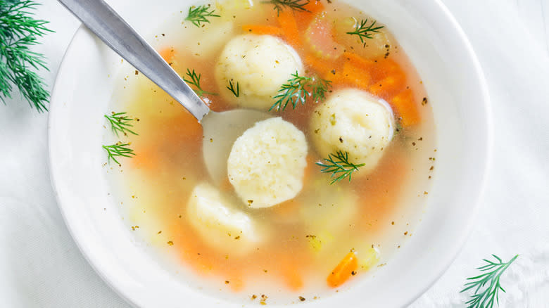 white bowl with matzoh ball soup